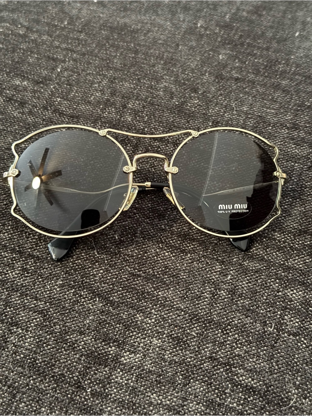 Miu Miu Gold Frame Sunglasses with Black Lenses